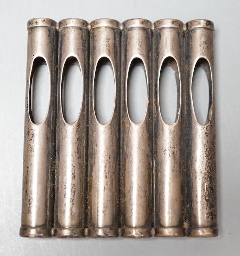 An Edwardian patent novelty cigarette holder, modelled as a magazine of bullets, William Maguires, Birmingham, 1904, 72mm.